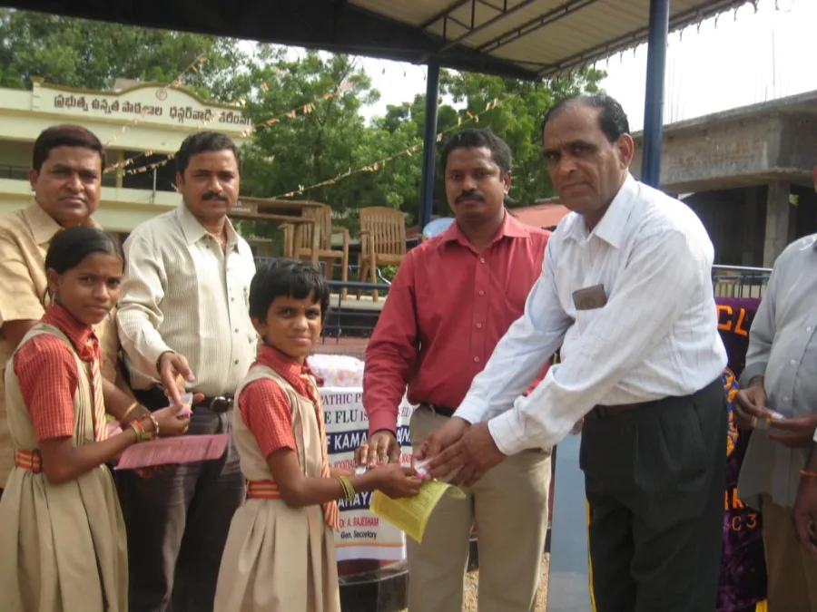 Preventive medicine being handed to students at a government school in Karimnagar